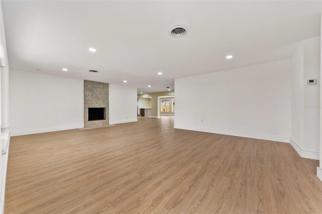1822 Banyan Tree Drive Edgewater, FL 32132 - Photo 7 of 63 a view of empty room with wooden floor and fan