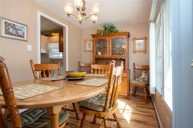 a living room filled with furniture and a large window