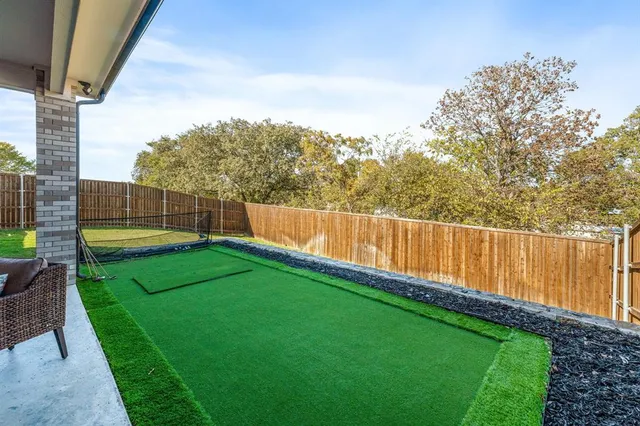 a view of a backyard with a lake view