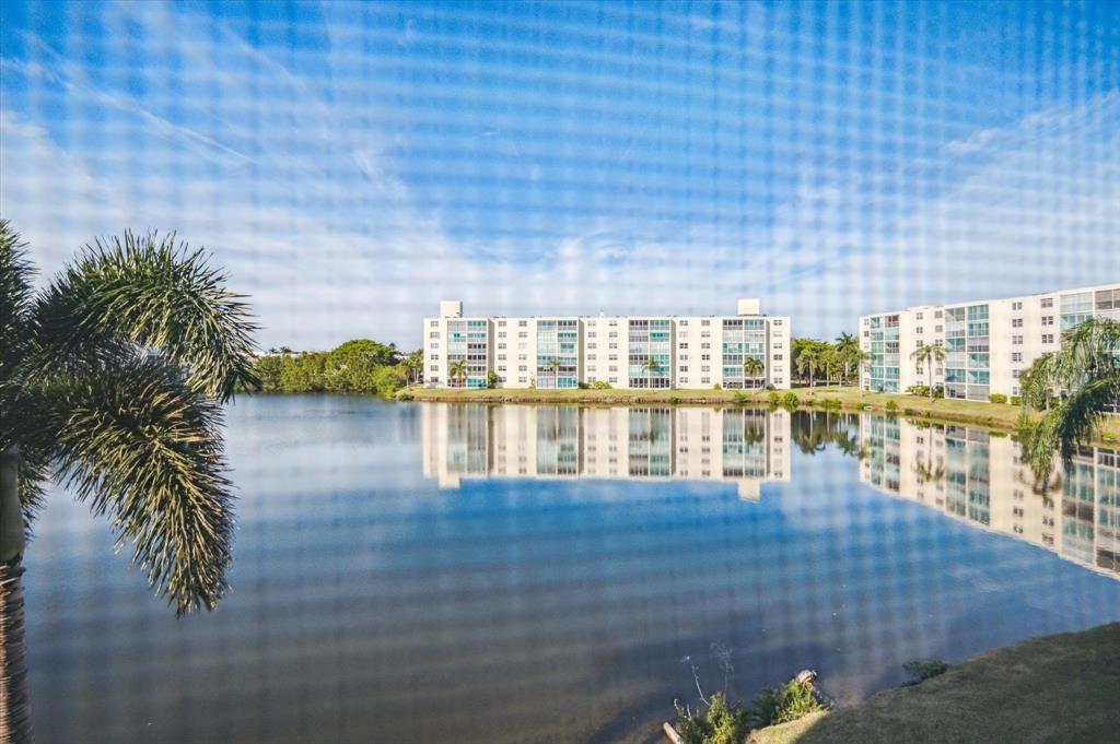 131 Southeast 3rd Avenue, Unit 302 Dania Beach, FL 33004 - Photo 15 of 16 a view of a balcony with lake