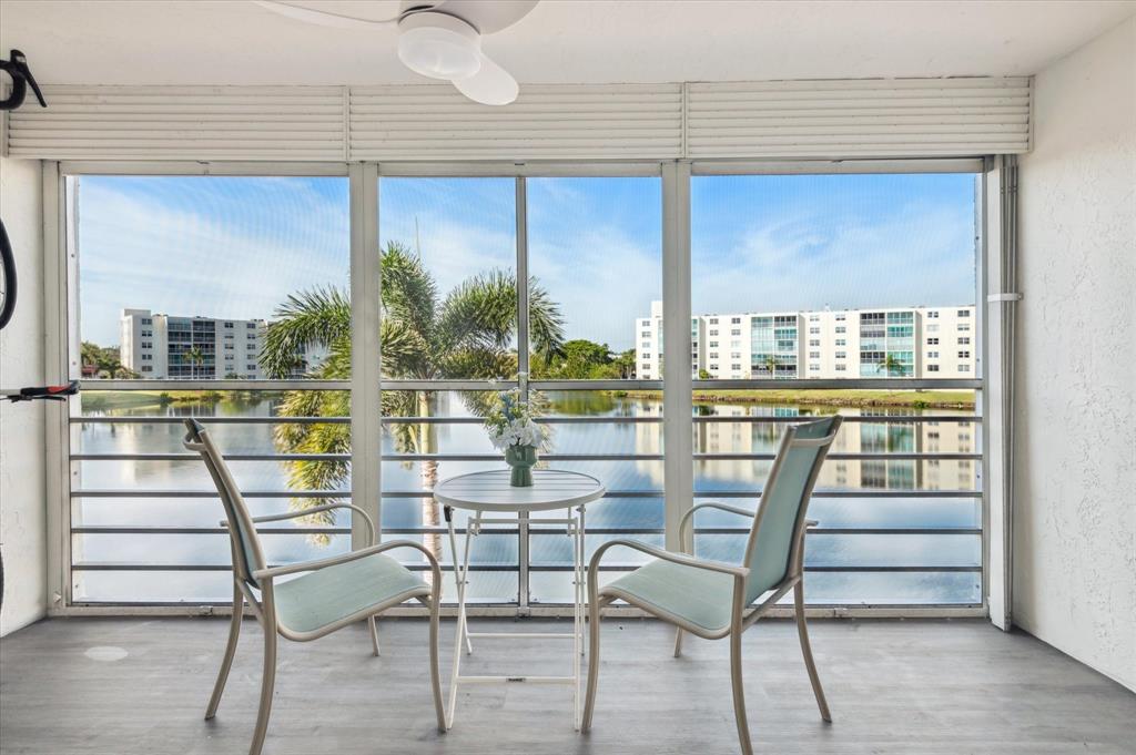 131 Southeast 3rd Avenue, Unit 302 Dania Beach, FL 33004 - Photo 2 of 16 a view of a chairs and table in the balcony
