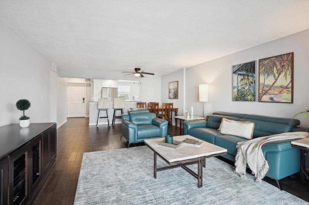 131 Southeast 3rd Avenue, Unit 302 Dania Beach, FL 33004 - Photo 7 of 16 a living room with furniture and wooden floor