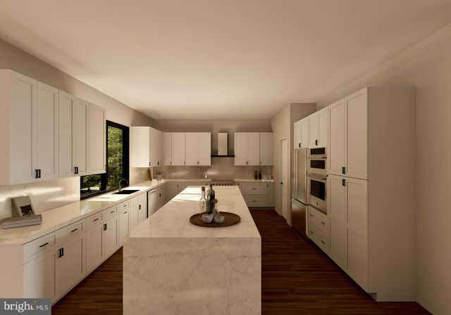 a kitchen with sink refrigerator and stove