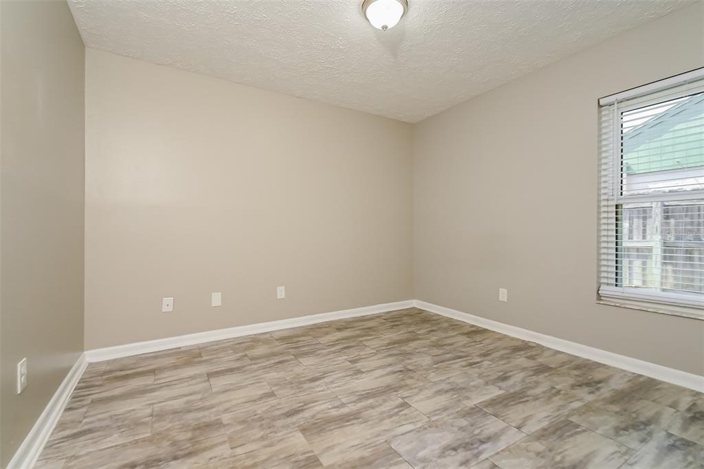 1601 Loghill Place Brandon, FL 33510 - Photo 13 of 15 wooden floor in an empty room with a window
