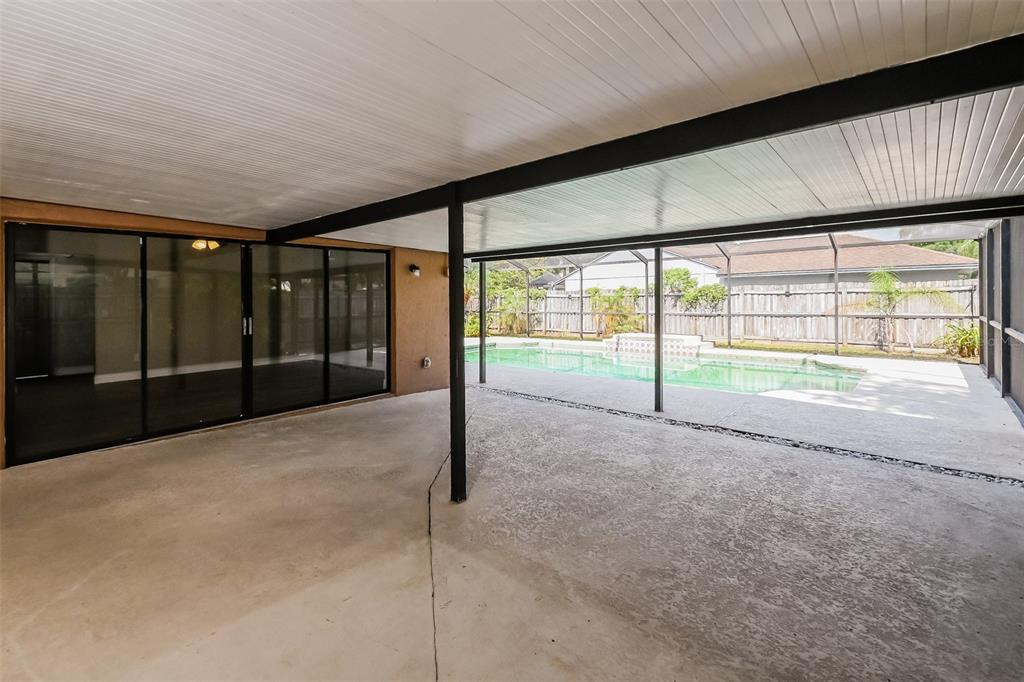 1601 Loghill Place Brandon, FL 33510 - Photo 8 of 15 a view of an empty room with wooden floor and a window