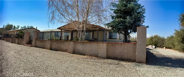 a view of a house with a small yard