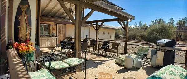 a view of balcony with furniture