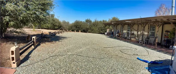 a view of a backyard of the house
