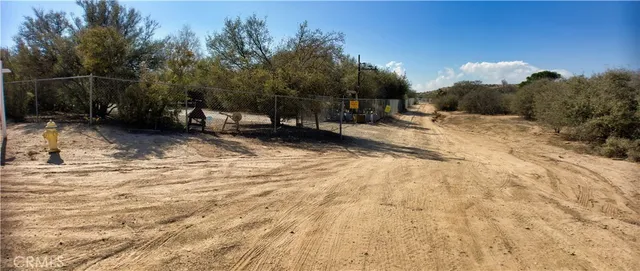 a view of a backyard of the house