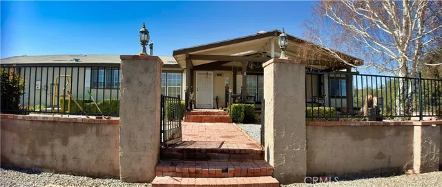 a front view of a house with a glass windows