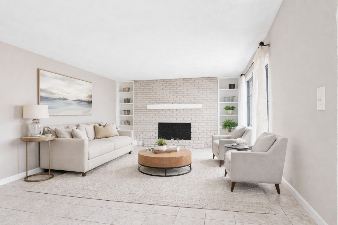 Bright, inviting living space centered around the fireplace. Virtually Staged