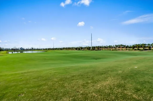 a view of a golf course with a lake