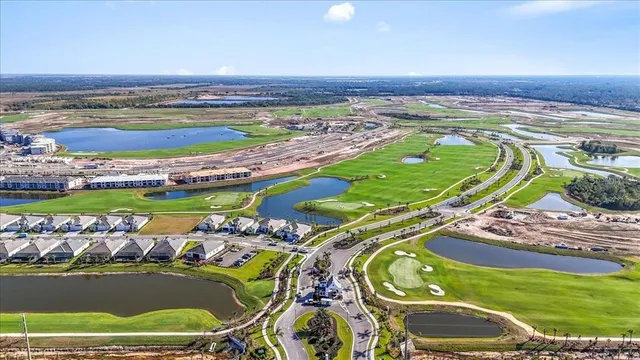 a view of a swimming pool with a lot of trees in front of it