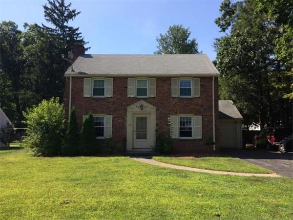 1562 Plumtree Road Springfield, MA 01119 - Photo 1 of 21 a front view of a house with a garden