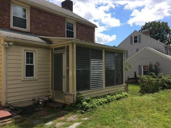 1562 Plumtree Road Springfield, MA 01119 - Photo 3 of 21 a front view of a house with garden