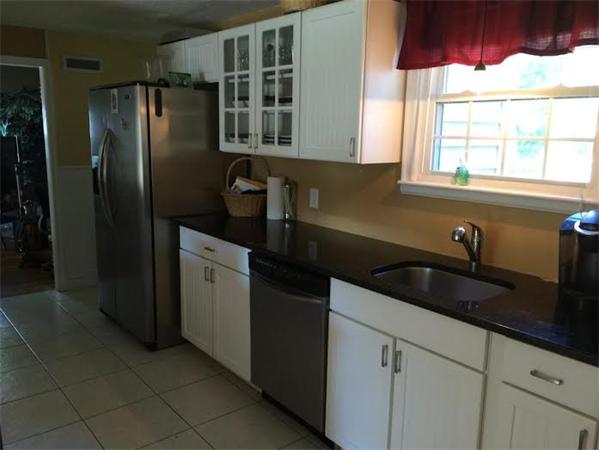 1562 Plumtree Road Springfield, MA 01119 - Photo 6 of 21 a kitchen with a sink and a refrigerator