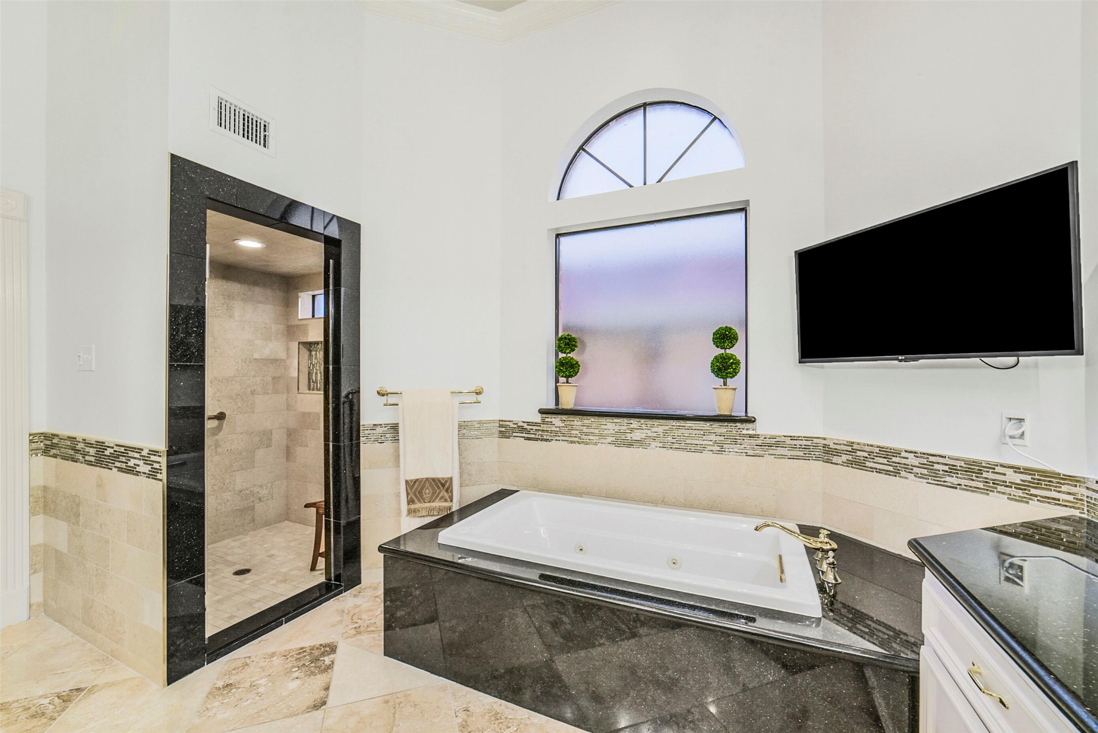 17302 Atherington Place Spring, TX 77379 - Photo 26 of 50 Spa-inspired bath featuring an oversized shower, Kohler jetted tub, and luxurious finishes.