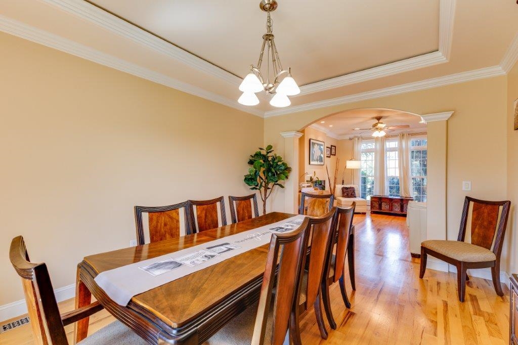 61 Bridgewater Road Bridgewater, VA 22812 - Photo 16 of 75 a living room with furniture a dining table and a chandelier