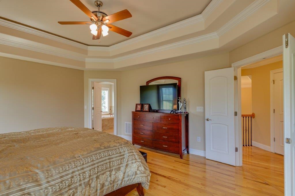 61 Bridgewater Road Bridgewater, VA 22812 - Photo 28 of 75 a bedroom with a bed and wooden floor