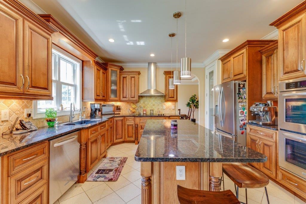 61 Bridgewater Road Bridgewater, VA 22812 - Photo 4 of 75 a kitchen with stainless steel appliances granite countertop a refrigerator a sink and a stove