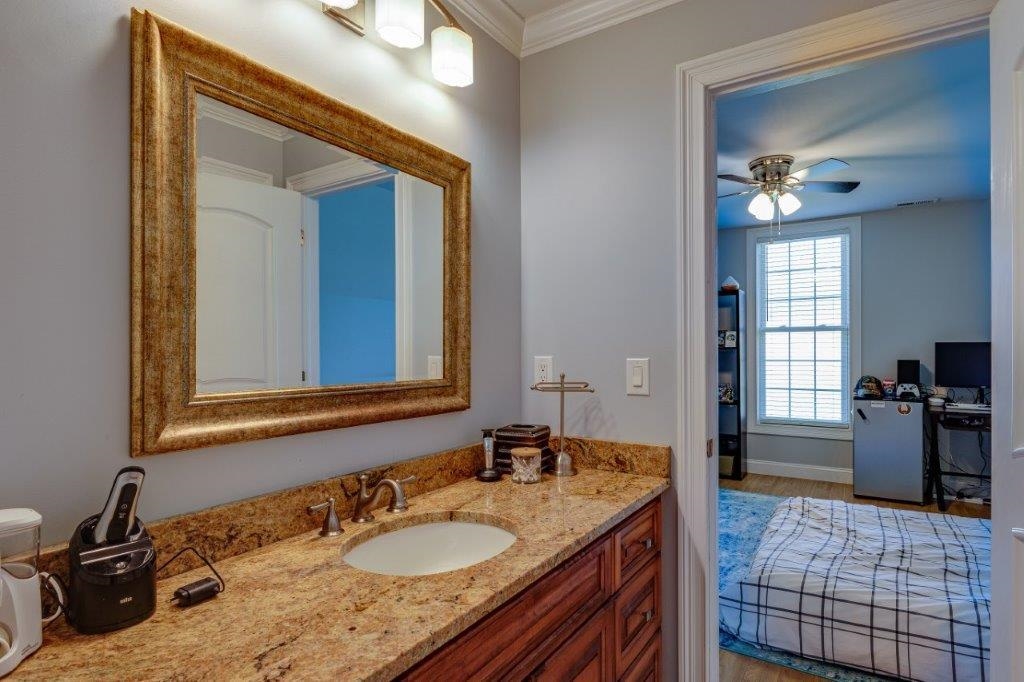 61 Bridgewater Road Bridgewater, VA 22812 - Photo 44 of 75 a bathroom with a granite countertop sink and a mirror