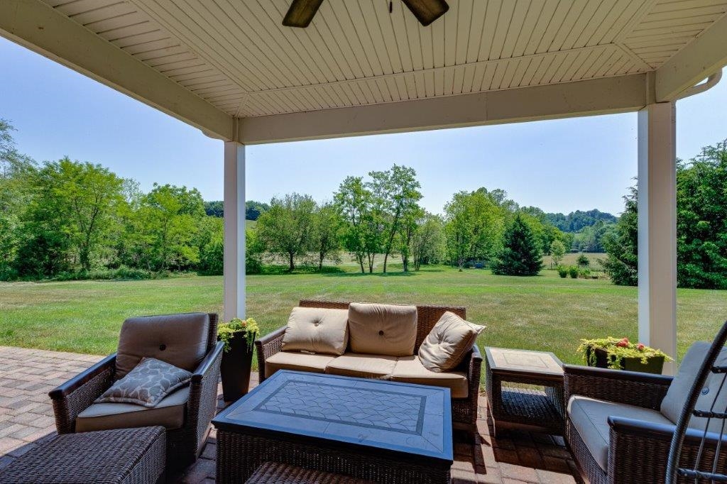 61 Bridgewater Road Bridgewater, VA 22812 - Photo 48 of 75 a view of a patio with table and chairs under an umbrella