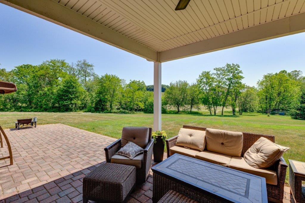 61 Bridgewater Road Bridgewater, VA 22812 - Photo 49 of 75 a view of a patio with lawn chairs next to a yard