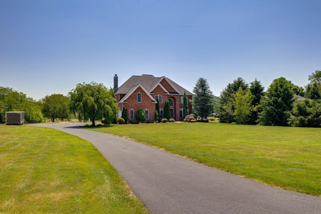 61 Bridgewater Road Bridgewater, VA 22812 - Photo 60 of 75 a front view of house with yard and trees in the background