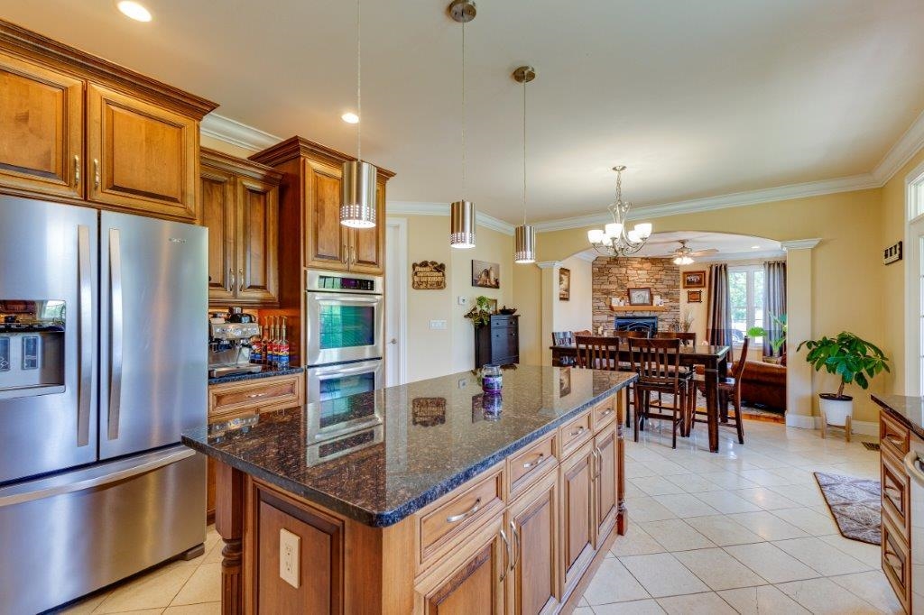 61 Bridgewater Road Bridgewater, VA 22812 - Photo 7 of 75 a kitchen with counter top space and stainless steel appliances