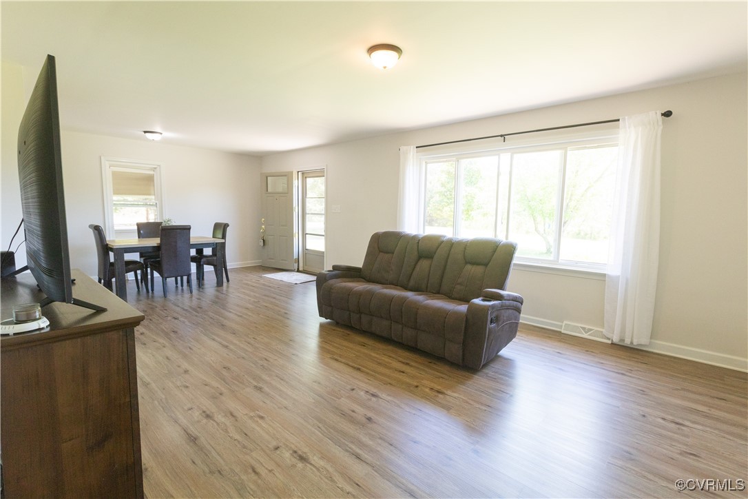 2729 Cumberland Road Farmville, VA 23901 - Photo 15 of 45 a living room with furniture wooden floor and a window