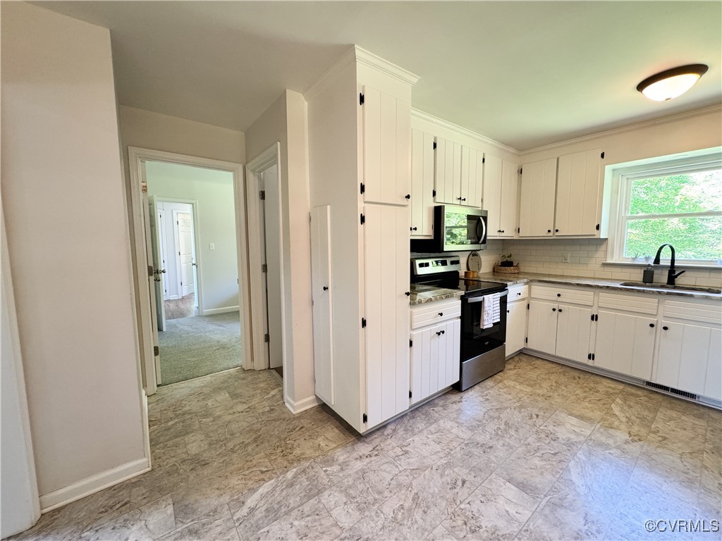 2729 Cumberland Road Farmville, VA 23901 - Photo 18 of 45 a kitchen with white cabinets and white appliances