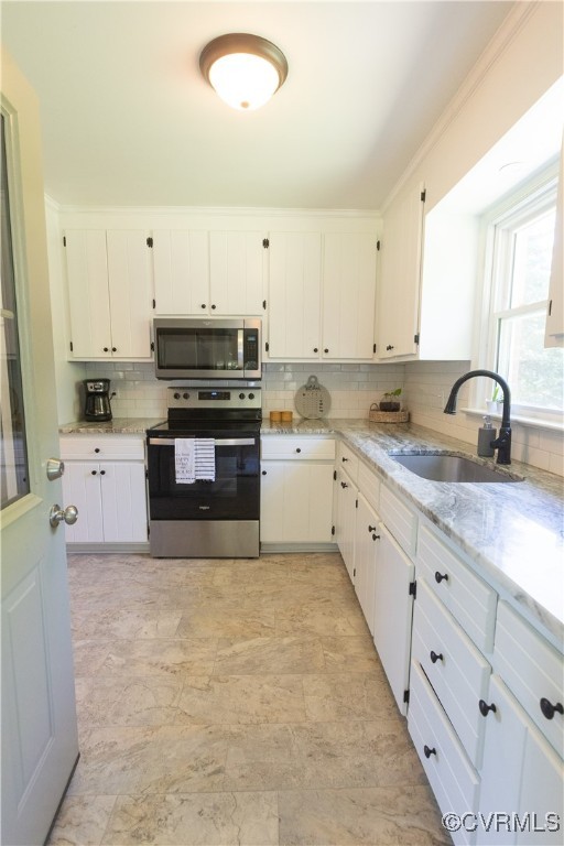 2729 Cumberland Road Farmville, VA 23901 - Photo 19 of 45 a kitchen with granite countertop a sink a stove and cabinets