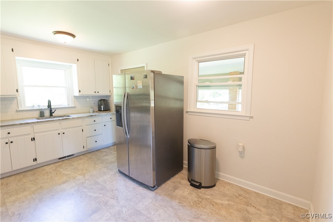 2729 Cumberland Road Farmville, VA 23901 - Photo 20 of 45 a kitchen with a refrigerator sink and cabinets