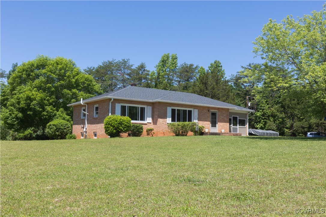 2729 Cumberland Road Farmville, VA 23901 - Photo 2 of 45 a front view of a house with a garden