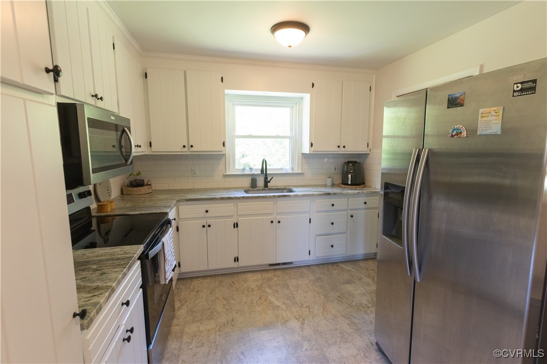 2729 Cumberland Road Farmville, VA 23901 - Photo 23 of 45 a kitchen with a sink stove and refrigerator
