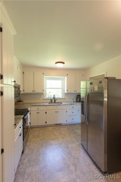 2729 Cumberland Road Farmville, VA 23901 - Photo 24 of 45 a kitchen with granite countertop a refrigerator and a sink