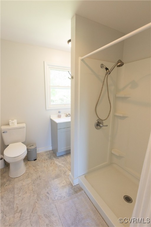 2729 Cumberland Road Farmville, VA 23901 - Photo 28 of 45 a bathroom with a granite countertop sink a toilet and shower