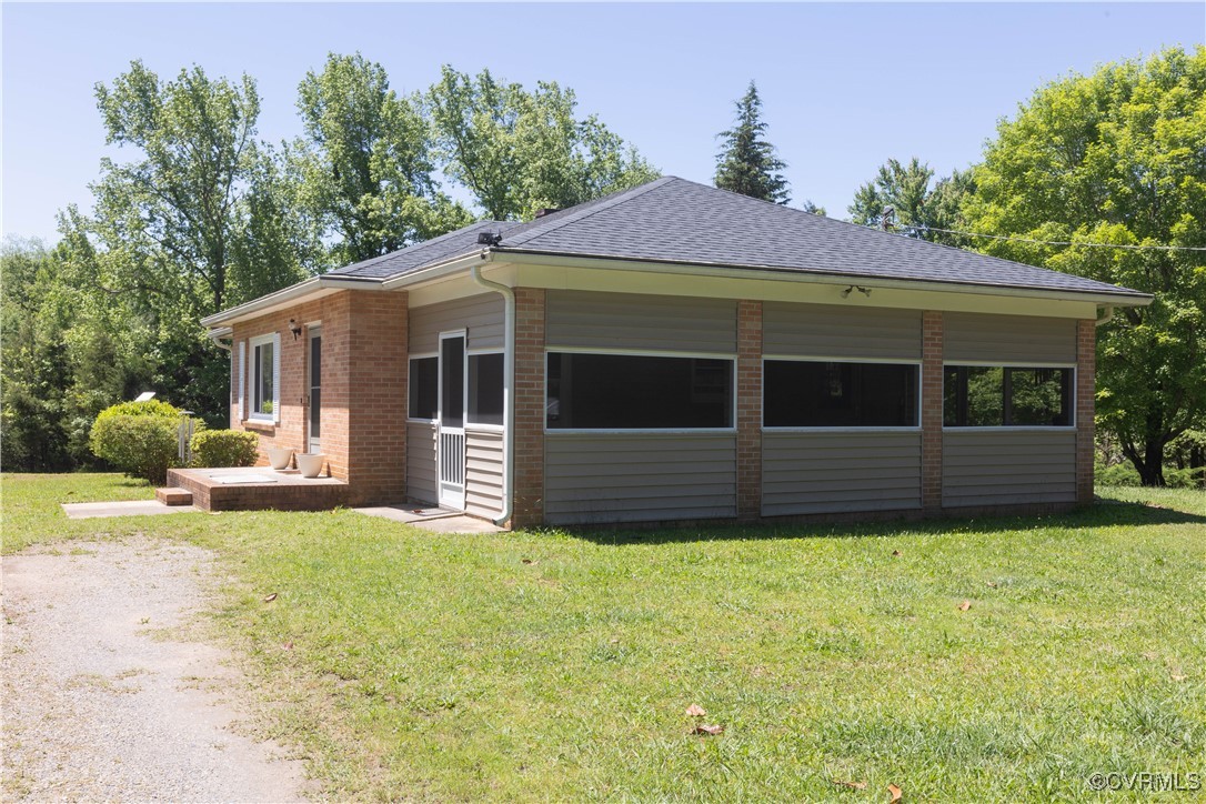2729 Cumberland Road Farmville, VA 23901 - Photo 3 of 45 a front view of a house with a yard and garage