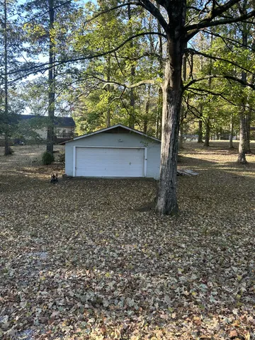 a view of a house with a tree