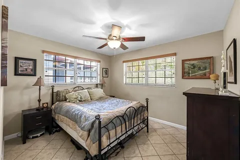 a bedroom with a bed and a table