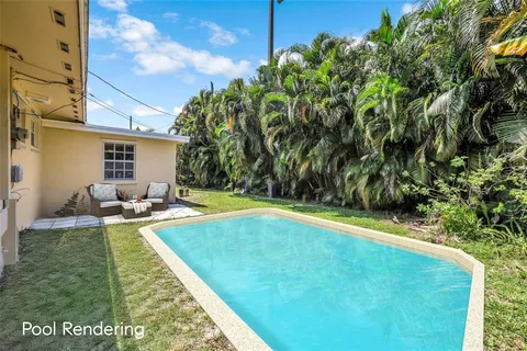 a view of a backyard with swimming pool
