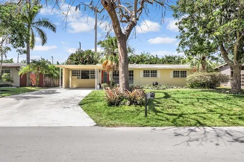 front view of a house with a garden