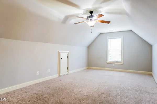 a spacious bathroom with a double sink shower and a mirror