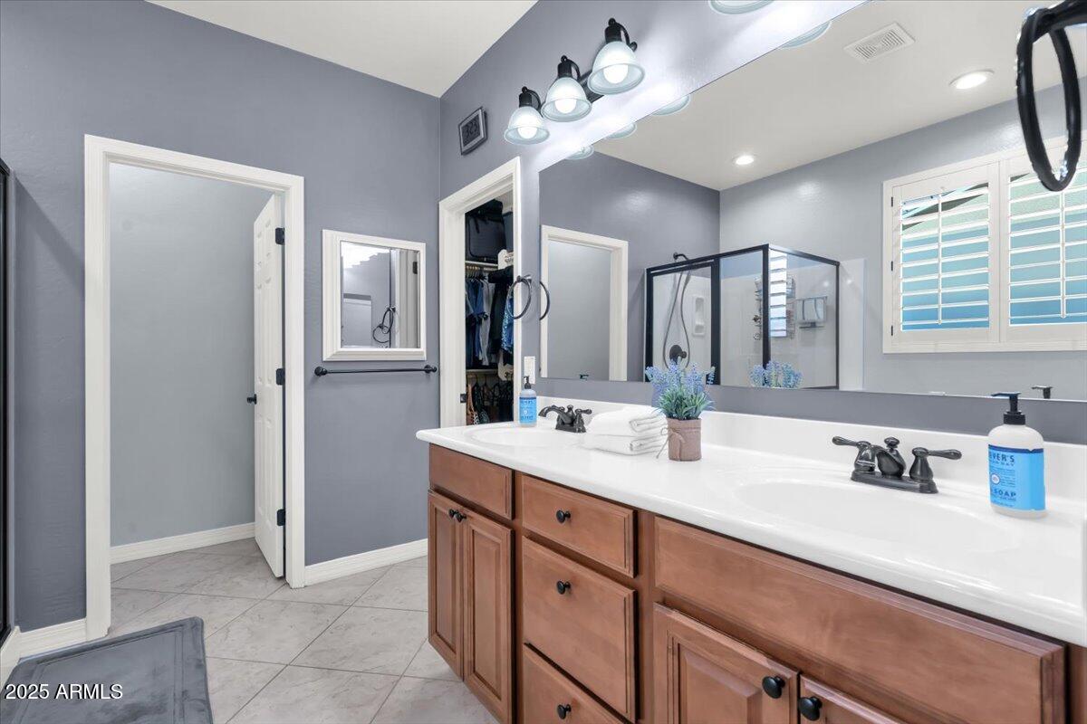 3214 North Springfield Street Buckeye, AZ 85396 - Photo 22 of 64 a spacious bathroom with a double vanity sink mirror and double