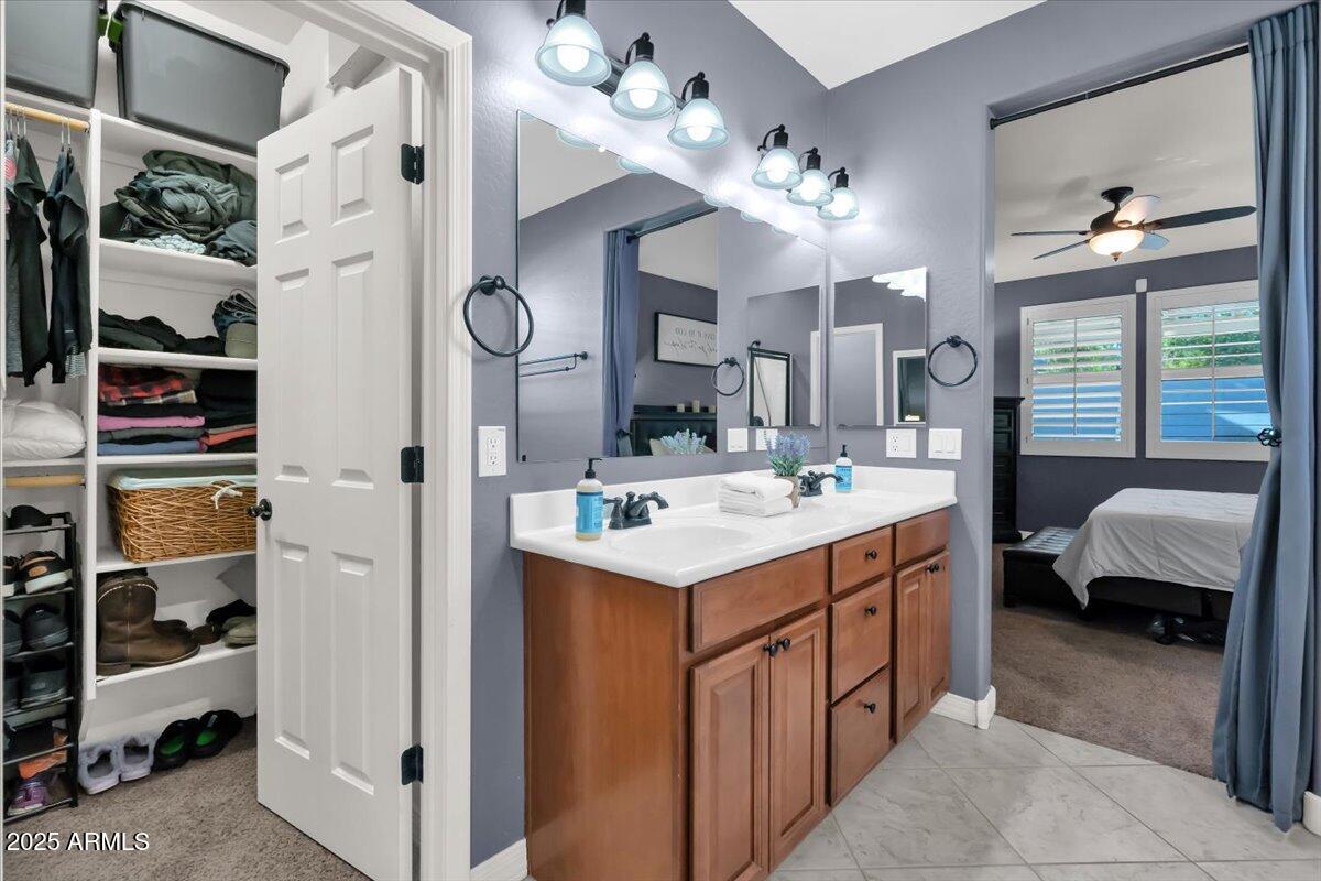 3214 North Springfield Street Buckeye, AZ 85396 - Photo 23 of 64 a kitchen that has a lot of cabinets and refrigerator