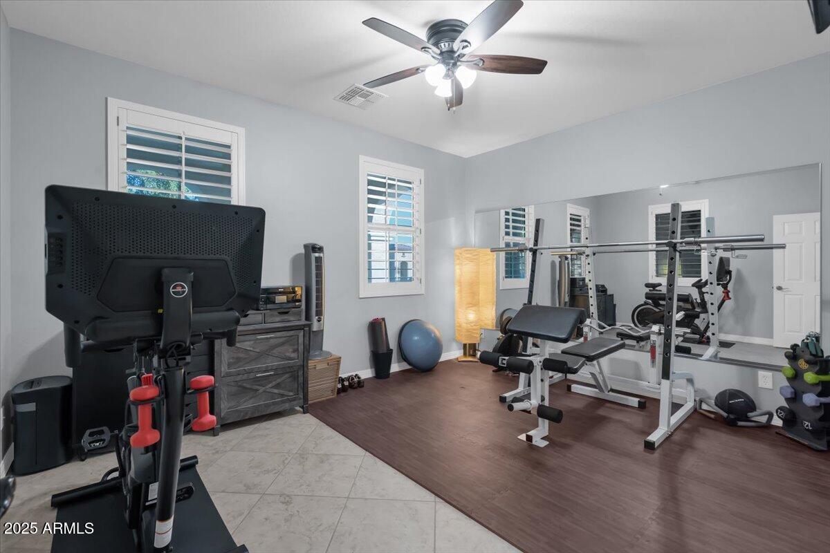 3214 North Springfield Street Buckeye, AZ 85396 - Photo 27 of 64 a view of a workspace with furniture and a window