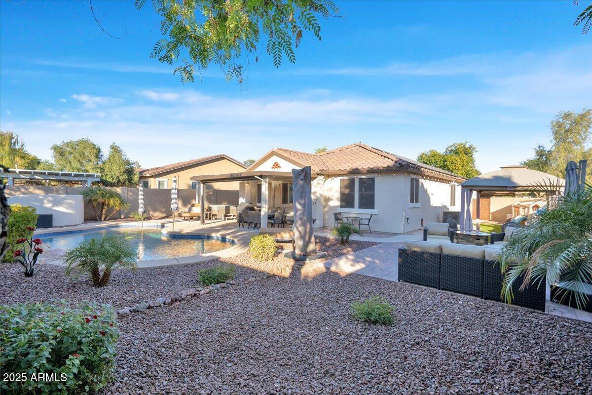 3214 North Springfield Street Buckeye, AZ 85396 - Photo 36 of 64 a view of a house with a yard and sitting area