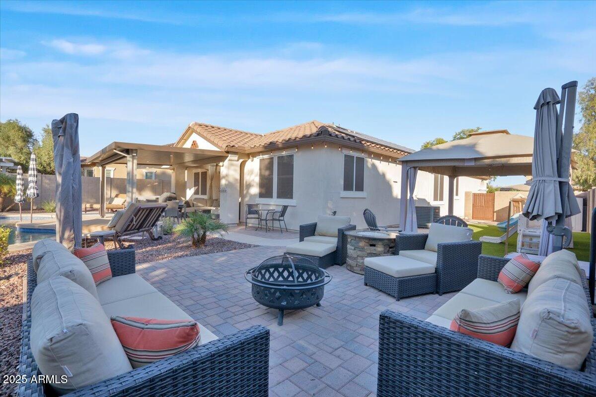 3214 North Springfield Street Buckeye, AZ 85396 - Photo 37 of 64 a view of a patio with couches and potted plants