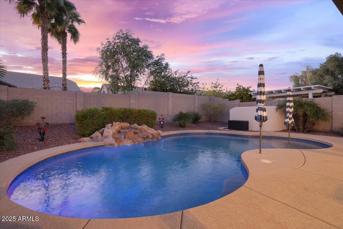 3214 North Springfield Street Buckeye, AZ 85396 - Photo 44 of 64 a view of a swimming pool and lounge chair