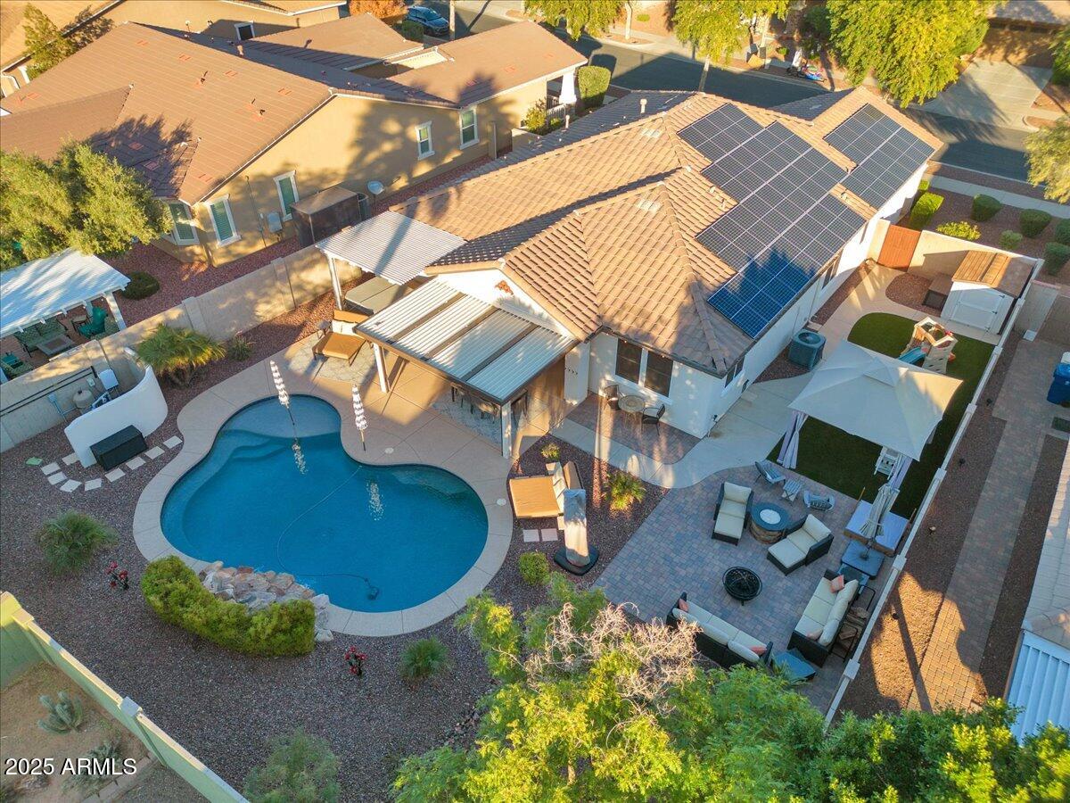 3214 North Springfield Street Buckeye, AZ 85396 - Photo 54 of 64 an aerial view of a house with backyard space and balcony